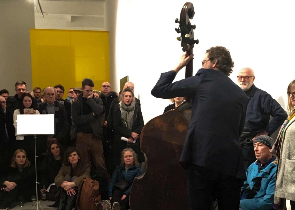 Dominic Lash performs a score by David Ryan at the PV of 'The Undersides of Practice' an exhibition at APT Gallery London. An APT SHOTS funded exhibition. Curated by Catherine Ferguson and Della Gooden.